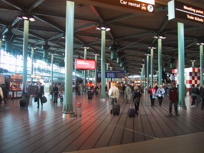 Schipol Airport is modern, well laid out and full of shops. The trains to Amsterdam are just around the corner and down the stairs.