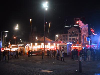 Dam square was occupied by a carnival midway with bungee and spinning rides. Lots of people and lights.