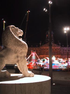 Across Damstraat from the carnival was the National monument and the Lion statue. Very impressive at night.