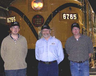 Posing proudly in front of CNR FPA #6765, the author (center) is joined by Jean-Paul Viaud, Curator and Kevin Robinson, Director of Educational Services to celebrate the formal transfer of the VEC to Exporail.