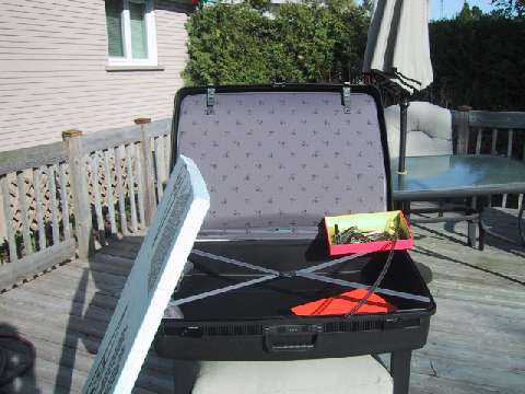 Delsey suitcase, styrofoam, track and sunshine