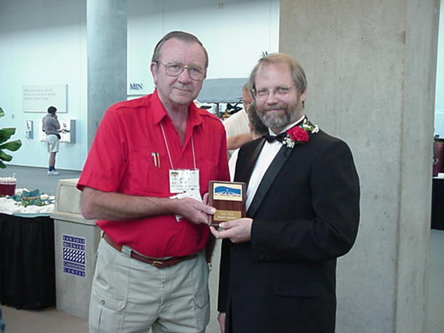 Jeff MacHan (in tux) receives the 2nd prize plaque from Chief Judge, John Selkirk.