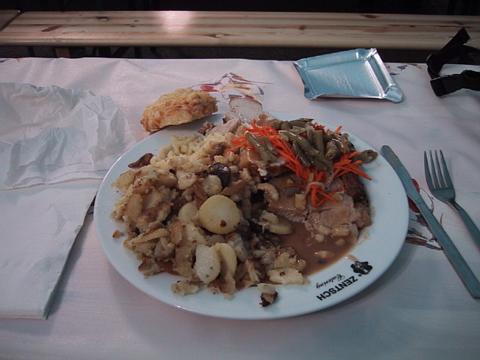 Plates piled high with delicious roast and potatoes