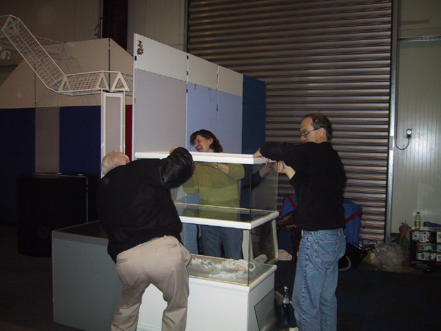 Terry Sutfin helps set up the FR booth along with Harald Freudenreich and Ilona.