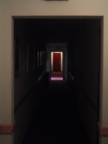 The gloomy hallway leading to our room
